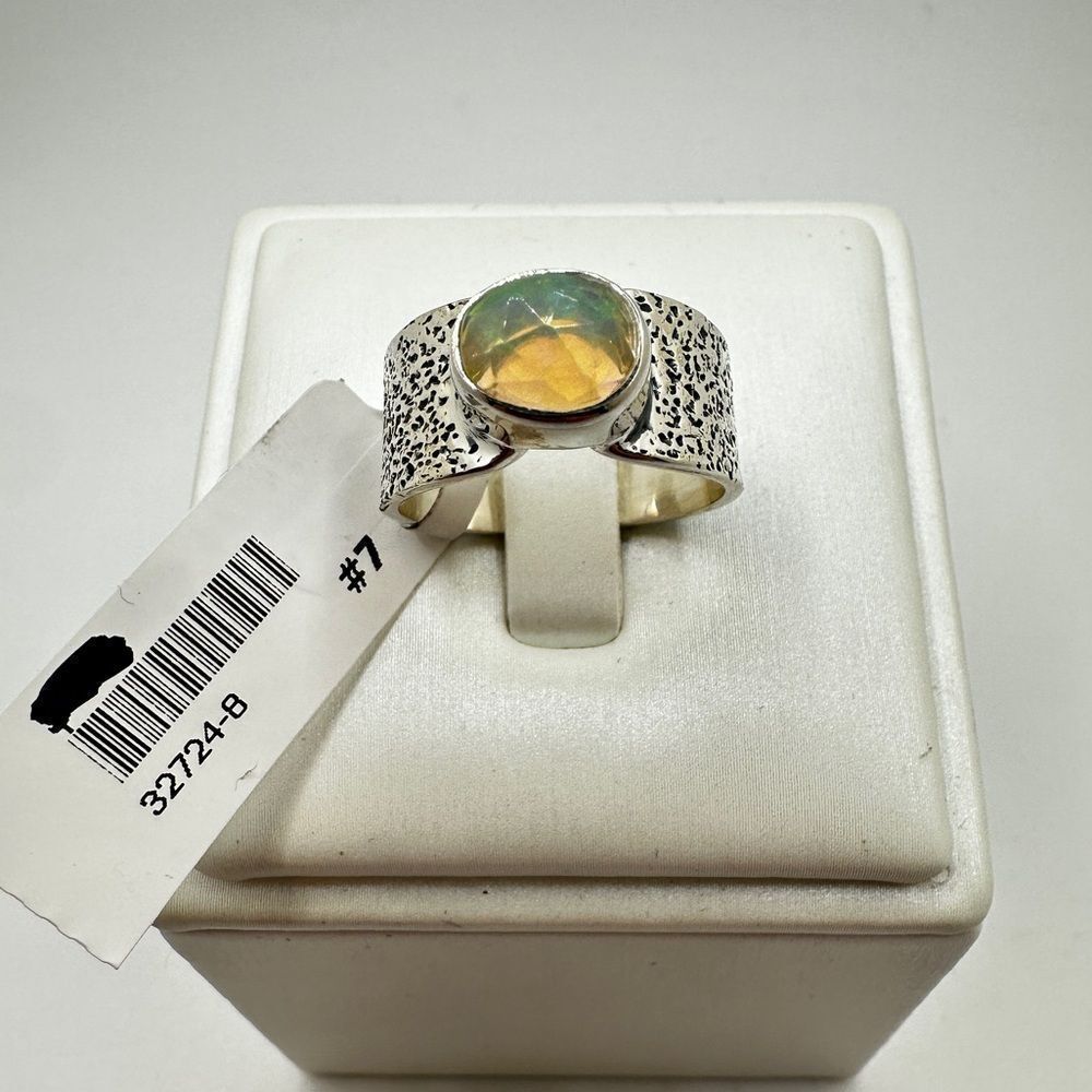 NWT 7x9mm faceted, oval cut opal ring in stamped sterling silver!